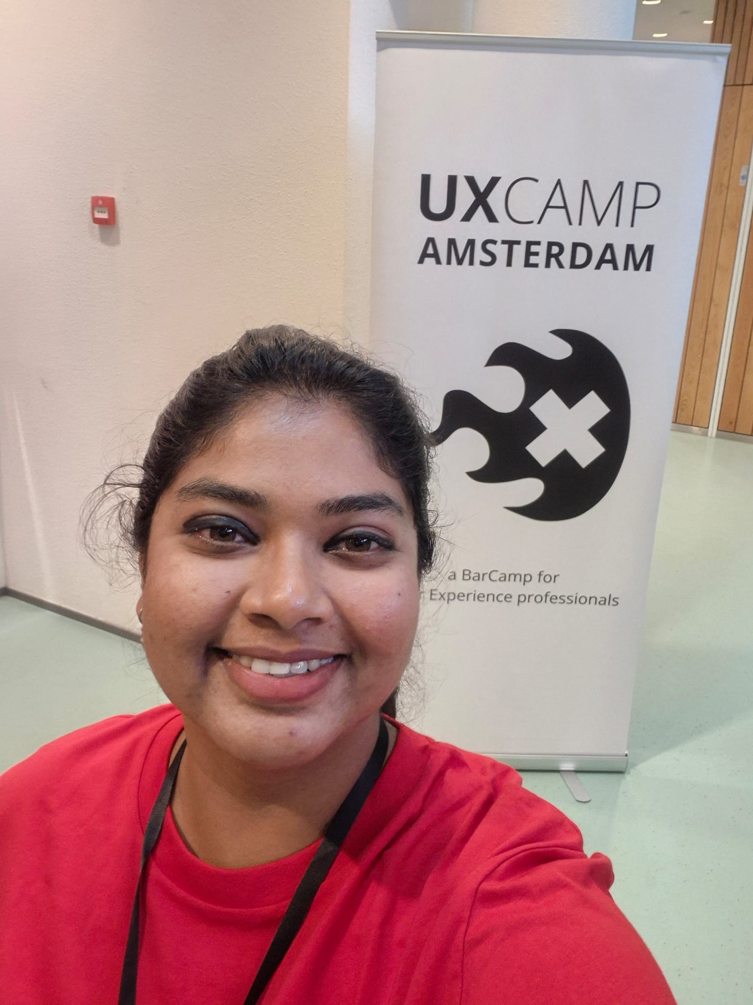 Meghana Gautam at the UX Camp Amsterdam banner